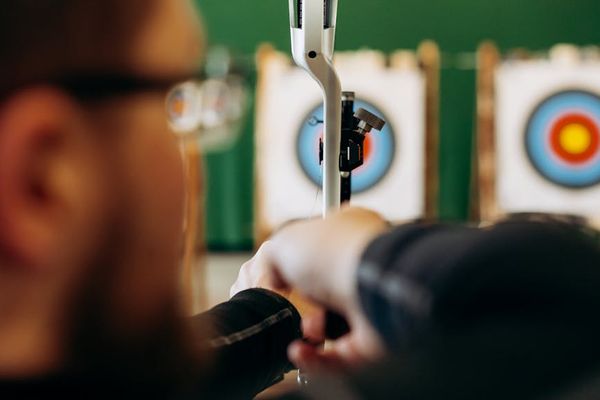Man focused during a workout, showing determination and control.